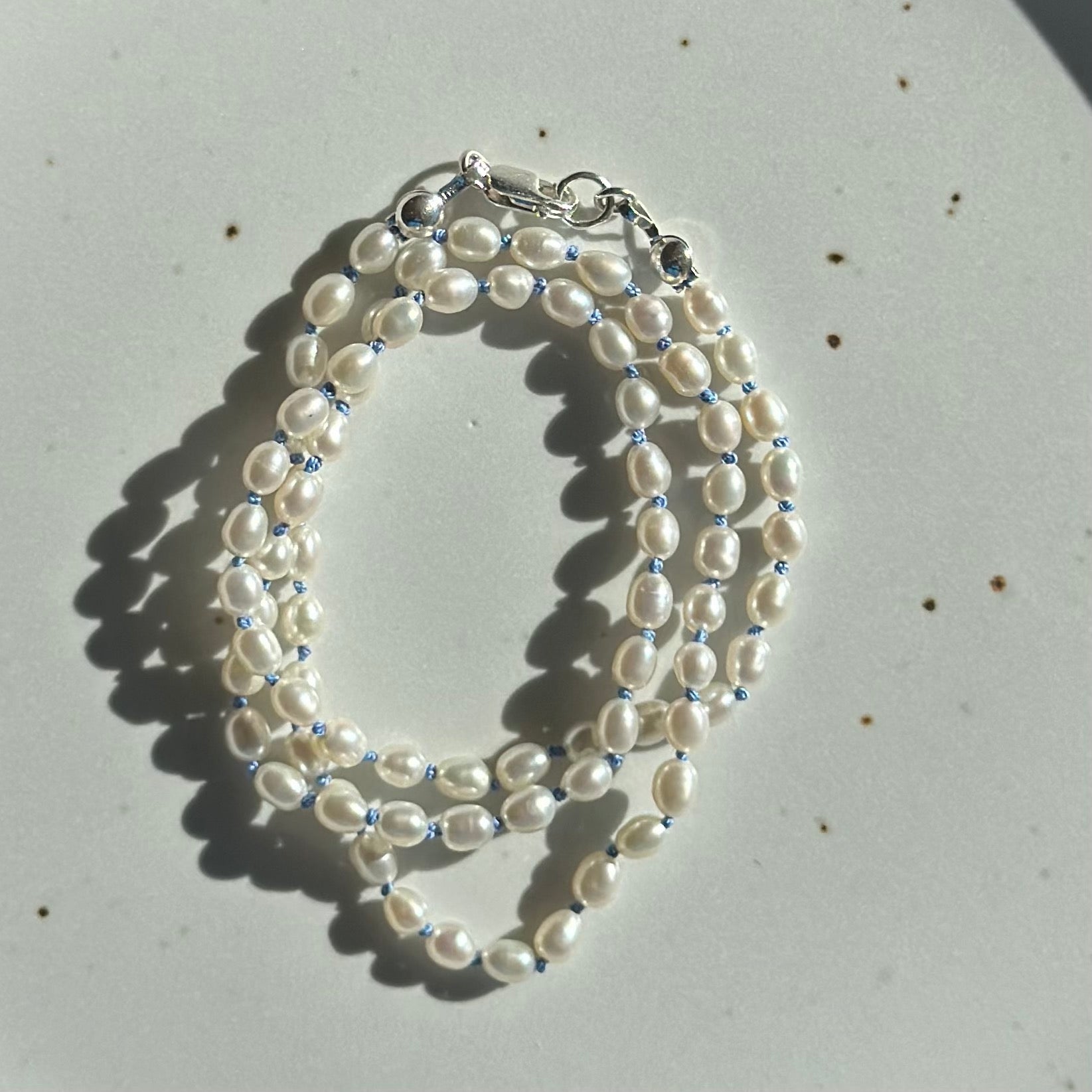 Pearls on Blue Silk 16.5