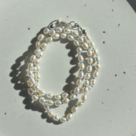 Pearls on Blue Silk 16.5