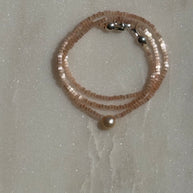 Single Pearl on Light Pink 15.25